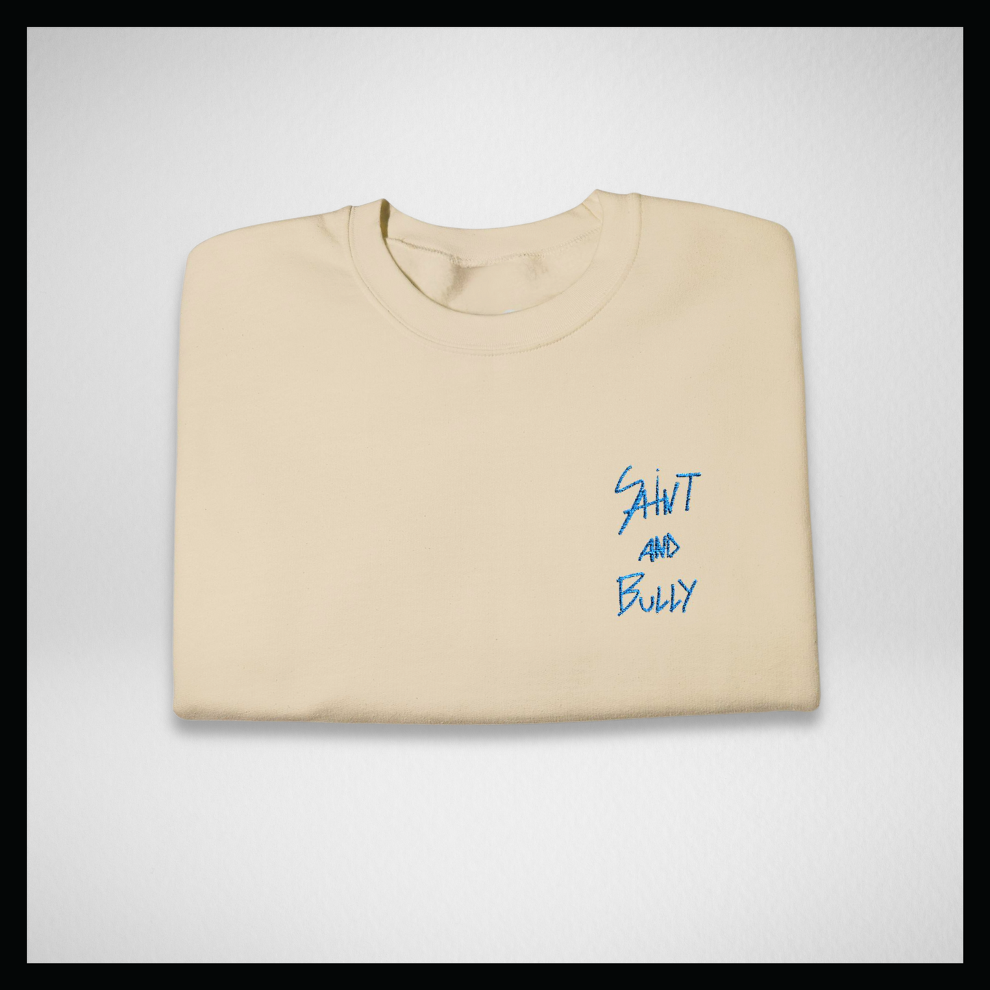 Light beige crewneck sweatshirt, hand-written light blue logo embroidered